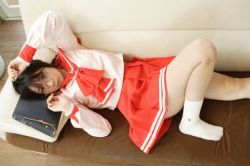 Rule 34 | 1girl, asian, black hair, character request, chocoball, cosplay, cosplay request, couch, glasses, indoors, knee up, lying, no shoes, on couch, photo (medium), school uniform, serafuku, socks, solo, source request, white socks, wooden floor