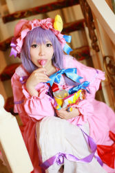 Rule 34 | 1girl, asian, candy, cosplay, crescent, dress, female focus, food, hat, highres, lollipop, long hair, patchouli knowledge, photo (medium), purple hair, solo, tenshi myu, touhou