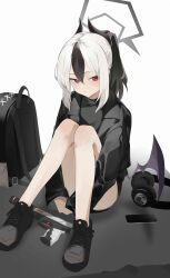 1girl absurdres black_bag black_footwear black_jacket black_shirt blue_archive blush cellphone closed_mouth demon_girl demon_horns demon_wings gun handgun headphones highres horns jacket kayoko_(blue_archive) knees_together_feet_apart looking_to_the_side multicolored_hair phone red_eyes shirt sitting smartphone toriko_(honmono) weapon wings