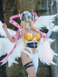 1girl absurdres angel angel_girl angel_wings angewomon angewomon_(cosplay) asymmetrical_clothes asymmetrical_legwear bare_shoulders blonde_hair breasts collarbone commentary cosplay covered_eyes digimon digimon_(creature) digimon_adventure elbow_gloves feathered_wings female_focus gloves helmet helmet_over_eyes highres legs_together long_hair looking_at_viewer luna_kamijo multiple_wings photo_(medium) pink_shawl real_life shawl thigh_strap thighs wings wrist_wings