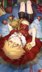 Rule 34 | 1boy, aged down, beads, bed sheet, bell, blonde hair, boots, bow, box, brown footwear, cape, child, child gilgamesh (fate), christmas, christmas ornaments, colored eyelashes, crop top, fate/hollow ataraxia, fate/stay night, fate (series), fringe trim, from behind, full body, gift, gift box, gilgamesh (fate), kan&#039;yu (citron 82), looking at viewer, looking back, lying, male focus, midriff, multiple boys, on back, red eyes, short hair, shorts, smile, solo, star (symbol), stuffed animal, stuffed toy, tassel, teddy bear