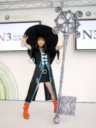Rule 34 | 1girl, :d, asian, bangle, black hat, blunt bangs, boots, bracelet, brown eyes, brown hair, cosplay, cosplay photo, full body, hat, holding, holding staff, indoors, jewelry, key, knee boots, legs apart, long hair, microsoft, nakagawa shoko, nakagawa shouko, ninety-nine nights, open mouth, oversized object, photo (medium), smile, solo, staff, standing, tyurru, witch, witch hat