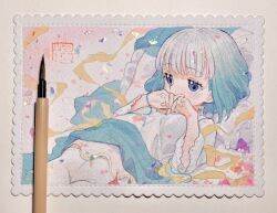 Rule 34 | 1girl, art tools in frame, blue eyes, blue hair, covering own mouth, gradient hair, highres, kaede (shijie heping), lying, multicolored hair, on back, original, own hands together, painting (medium), pantyhose, photo (medium), pillow, shirt, short hair, solo, traditional media, two-tone hair, upper body, watercolor (medium), white hair, white pantyhose, white shirt