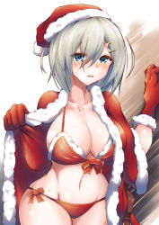 Rule 34 | 1girl, bikini, blue eyes, breasts, cape, christmas, cleavage, collarbone, commentary request, cowboy shot, fur-trimmed bikini, fur-trimmed cape, fur-trimmed gloves, fur trim, gloves, hair ornament, hairclip, hamakaze (kancolle), hat, highres, kantai collection, large breasts, pulumelo, red bikini, red cape, red gloves, santa hat, short hair, side-tie bikini bottom, silver hair, solo, swimsuit