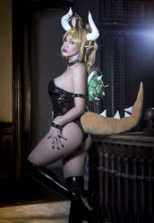 Rule 34 | 1girl, argentine (nationality), armlet, ass grab, bare legs, bare shoulders, black leotard, blonde hair, bowsette, bowsette (cosplay), bracelet, breasts, cosplay, crown, curvy, grabbing own ass, high ponytail, highleg, highleg leotard, highres, horns, jewelry, leotard, lips, long hair, looking at viewer, mario (series), new super mario bros. u deluxe, nintendo, parted lips, photo (medium), solo, sophie valentine, spiked armlet, spiked bracelet, spikes, strapless, strapless leotard, tail, wide hips
