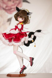 Rule 34 | 1girl, animal ears, bell, blurry, blurry background, brown eyes, brown hair, cat ears, cat girl, cat tail, character doll, chen, embellished costume, figure, from side, full body, hat, high heels, highres, jingle bell, kneehighs, lace, lace-trimmed headwear, lace-trimmed shirt, lace trim, long sleeves, looking at viewer, looking to the side, mary janes, medium hair, miyako sasara, mob cap, multiple tails, nekomata, open mouth, photo (medium), red footwear, red skirt, red vest, ribbon, shirt, shoes, skirt, skirt set, sleeves past wrists, smile, socks, solo, standing, standing on one leg, tail, touhou, two tails, vest, white shirt, white socks, yellow ribbon