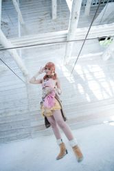Rule 34 | 1girl, belt, boots, bracelet, building, cosplay, female focus, final fantasy, final fantasy xiii, full body, indoors, jewelry, midriff, necklace, oerba dia vanille, oerba dia vanille (cosplay), photo (medium), pink shirt, shirt, skirt, solo, standing, twintails
