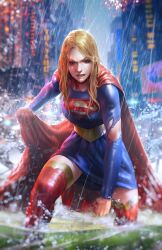 Rule 34 | 1girl, belt, blonde hair, blue dress, blue eyes, blurry, blurry background, boots, cape, city, clenched hand, dc comics, dcwj, depth of field, dress, highres, long hair, looking at viewer, outdoors, rain, red cape, red footwear, solo, supergirl, superman (series), thigh boots, torn clothes, torn sleeves, wet