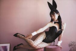 Rule 34 | 1girl, black leotard, breasts, chair, cleavage, leotard, photo (medium), playboy bunny, uesaka sumire