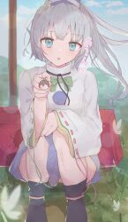 Rule 34 | 1girl, absurdres, black footwear, blue eyes, blue hat, blue sky, bow, bowtie, commentary, flower, food, full body, green bow, green bowtie, grey hair, hat, highres, holding, holding food, japanese clothes, kariginu, long hair, looking at viewer, matcha yado, mononobe no futo, open mouth, pom pom (clothes), ponytail, ribbon-trimmed sleeves, ribbon trim, sitting, sky, solo, tate eboshi, touhou, wide sleeves