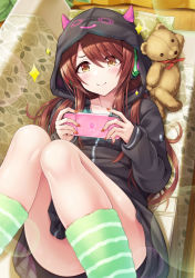 Rule 34 | 1girl, ass, black jacket, blush, brown eyes, brown hair, closed mouth, commentary request, couch, fake horns, feet out of frame, green socks, hair over one eye, handheld game console, headphones, highres, holding, hood, hood up, hooded jacket, horned hood, horns, idolmaster, idolmaster shiny colors, indoors, jacket, knees up, long hair, long sleeves, looking at viewer, lying, nail polish, on back, on couch, osaki tenka, pillow, red nails, sleeves past wrists, smile, socks, solo, sparkle, striped clothes, striped socks, stuffed animal, stuffed toy, teddy bear, urabi (tomatohouse), very long hair
