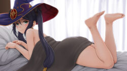 Rule 34 | 1girl, ass, bare shoulders, barefoot, bed sheet, black hair, blush, duzimura, feet, feet up, genshin impact, green eyes, hat, legs, long hair, looking at viewer, looking back, lying, mona (genshin impact), on stomach, pillow, soles, solo, toes, twintails, witch hat