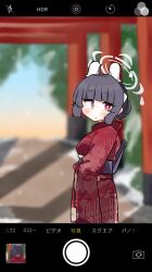 Rule 34 | 1girl, :o, ahoge, black hair, blue archive, blurry, blurry background, blush, cellphone display, dash b, day, depth of field, floral print, hair bun, halo, headgear, highres, japanese clothes, kimono, looking at viewer, looking to the side, miyu (blue archive), outdoors, parted lips, print kimono, red eyes, red kimono, solo, torii