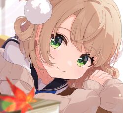 1girl black_sailor_collar blonde_hair blurry blurry_foreground blush brown_cardigan cardigan closed_mouth commentary green_eyes hair_ornament hair_rings highres leaf long_sleeves looking_at_viewer maple_leaf natu_zora pom_pom_(clothes) pom_pom_hair_ornament portrait sailor_collar school_uniform shigure_ui_(vtuber) short_hair smile solo virtual_youtuber