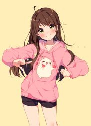 Rule 34 | 1girl, ahoge, artist name, bike shorts, black shorts, blush, brown hair, closed mouth, commentary, cowboy shot, drawstring, english commentary, green eyes, head tilt, hood, hood down, hoodie, hyanna-natsu, long hair, long sleeves, looking at viewer, original, pink hoodie, pointing, pointing at self, print hoodie, shorts, simple background, smile, solo, swept bangs, yellow background
