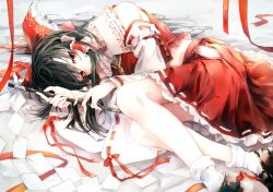 Rule 34 | 1girl, bare shoulders, black footwear, black hair, bow, hair ornament, hakurei reimu, japanese clothes, long hair, looking at viewer, lying, miko, on side, red bow, red eyes, red skirt, safutsuguon, shoes, skirt, socks, solo, touhou, white socks