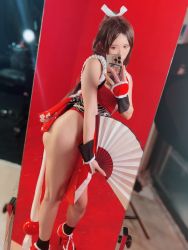 Rule 34 | 1girl, ass, brown hair, cellphone, cosplay, fatal fury, hand fan, highres, jill mw, long hair, ninja, phone, shiranui mai, shiranui mai (cosplay), sleeveless, snk, the king of fighters