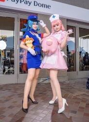 Rule 34 | 2girls, blue hair, creatures (company), dress, game freak, glico happy, heels, highres, jenny (pokemon), joy (pokemon), multiple girls, nintendo, nurse, pink dress, pink hair, poke ball, pokemon, pokemon (anime), pokemon (classic anime)