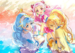 Rule 34 | 10s, 3girls, :d, arm up, beach, blonde hair, blue eyes, blue hair, brown eyes, commentary request, cone hair bun, cure ange, cure etoile, cure yell, earrings, hair bun, hoshi (xingspresent), hugtto! precure, jewelry, kagayaki homare, looking at viewer, looking back, magical girl, midriff, multiple girls, nono hana, open mouth, pink eyes, pink hair, precure, sitting, smile, star (symbol), star earrings, water, wrist cuffs, yakushiji saaya
