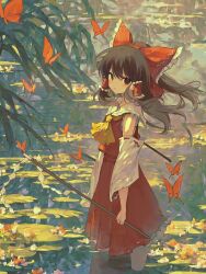 Rule 34 | 1girl, ascot, bow, brown hair, bug, butterfly, closed mouth, commentary, detached sleeves, frilled bow, frilled hair tubes, frills, gohei, hair bow, hair tubes, hakurei reimu, hashtag-only commentary, highres, holding, holding gohei, insect, long hair, looking at viewer, red bow, red eyes, red skirt, ribbon-trimmed sleeves, ribbon trim, skirt, skirt set, solo, touhou, water, yellow ascot, yutsukiicookie