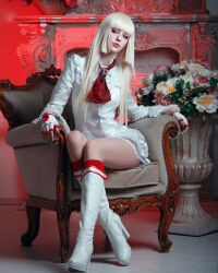 Rule 34 | 1girl, blonde hair, boots, breasts, chair, cosplay, emilie de rochefort, emilie de rochefort (cosplay), fingerless gloves, fireplace, flower, gloves, highres, long hair, long sleeves, medium breasts, nelly laufeyson, photo (medium), real life, sitting, solo, tekken, thighs