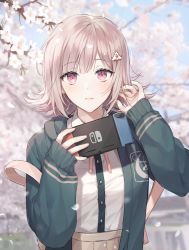Rule 34 | 1girl, absurdres, bag, blouse, brown skirt, cherry blossoms, closed mouth, collared shirt, commentary request, danganronpa (series), danganronpa 2: goodbye despair, day, doomie1, dress shirt, flipped hair, frown, green jacket, hair ornament, hairclip, hand in own hair, handheld game console, hands up, highres, holding, holding handheld game console, hood, hooded jacket, jacket, light brown hair, looking at viewer, nanami chiaki, neck ribbon, nintendo switch, open clothes, open jacket, outdoors, petals, pink eyes, pink ribbon, pleated skirt, ribbon, shirt, shirt tucked in, skirt, sleeves past wrists, solo, spaceship hair ornament, upper body, white shirt
