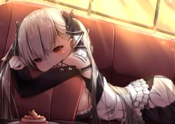 Rule 34 | 1girl, azur lane, backlighting, bare shoulders, black dress, blush, breasts, cake, couch, dress, earrings, food, formidable (azur lane), frilled dress, frills, grey hair, hair ornament, hair ribbon, highres, indoors, jewelry, large breasts, long hair, long sleeves, looking at viewer, lying, on stomach, red eyes, ribbon, solo, sunset, twintails, umou (may65879)