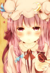 Rule 34 | 1girl, blunt bangs, blush, candy, capelet, chocolate, chocolate heart, crescent, double bun, dress, food, frilled sleeves, frills, hair bun, hair ribbon, hat, hat ornament, hat ribbon, heart, highres, long hair, looking at viewer, misa (kaeruhitode), mob cap, patchouli knowledge, purple eyes, purple hair, reaching, reaching towards viewer, ribbon, solo, striped clothes, striped dress, touhou, tress ribbon, upper body, valentine, yellow background