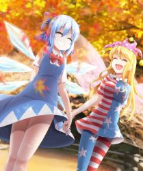 Rule 34 | 2girls, ^ ^, american flag dress, american flag legwear, autumn, blonde hair, blue hair, bow, breasts, cirno, closed eyes, clownpiece, dress, evandragon, fairy wings, grin, hair bow, hat, highres, holding hands, ice, ice wings, jester cap, jpeg artifacts, leaf, long hair, maple leaf, medium breasts, multiple girls, open mouth, pantyhose, short hair, small breasts, smile, star (symbol), striped clothes, striped dress, touhou, very long hair, wings