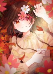 Rule 34 | 1girl, autumn, blush, brown hair, camera, closed mouth, commentary request, cosmos (flower), flower, highres, holding, holding camera, holding flower, long sleeves, lying, neck ribbon, on back, original, rai miruku, red eyes, ribbon, short hair, smile, solo, yellow ribbon