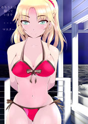 Rule 34 | 1girl, arms behind back, bikini, breasts, cleavage, cowboy shot, fate/apocrypha, fate/grand order, fate (series), front-tie top, green eyes, groin, large breasts, meow7tail, mordred (fate), mordred (fate) (all), mordred (fate/apocrypha), mordred (swimsuit rider) (fate), mordred (swimsuit rider) (first ascension) (fate), navel, ocean, raised eyebrows, red bikini, side-tie bikini bottom, side-tie bottom, smile, solo, swimsuit, text focus, thigh gap, translation request, water