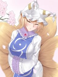 Rule 34 | 1girl, animal ear fluff, animal hat, blonde hair, blush, branch, breasts, cherry blossoms, commentary, cowboy shot, doitsuudon, dress, fox tail, hair between eyes, hands in opposite sleeves, hat, highres, large breasts, looking at viewer, mob cap, multiple tails, parted lips, petals, pink background, short hair, simple background, solo, tabard, tail, touhou, white dress, white hat, wide sleeves, yakumo ran, yellow eyes