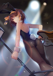 Rule 34 | 1girl, animal costume, animal ears, arms at sides, ass, back, bare back, black leotard, black pantyhose, blurry, blurry background, brown hair, dutch angle, electric guitar, eyes visible through hair, fake animal ears, from behind, guitar, hairband, highres, hmniao, holding, instrument, italia mondial, leotard, looking at viewer, looking back, microphone stand, pantyhose, playboy bunny, rabbit ears, rabbit tail, revision, short hair, smile, solo, stage, stage lights, suzumiya haruhi, suzumiya haruhi no yuuutsu, tail, twisted neck, wrist cuffs, yellow eyes