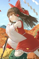 Rule 34 | 1girl, arm up, ascot, autumn leaves, bare shoulders, belt, blue sky, bow, brown eyes, brown hair, closed mouth, cloud, collar, collared dress, detached sleeves, dress, flying, frilled bow, frilled collar, frilled dress, frills, gohei, hair between eyes, hair ornament, hair tubes, hakurei reimu, hand up, highres, leaf, leg up, long hair, long sleeves, looking to the side, mountain, nail polish, nanasuou, pink nails, red bow, red dress, sky, solo, touhou, tree, white belt, wide sleeves, yellow ascot