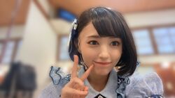 1girl aida_rikako blurry blurry_background costume indoors lipstick looking_at_viewer makeup photo_(medium) real_life selfie short_hair smile solo standing v voice_actor