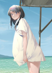 1girl absurdres beach black_hair blue_eyes commentary_request day highres joehongtee long_hair long_shirt looking_at_viewer ocean original outdoors shirt short_sleeves solo white_shirt