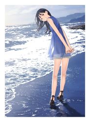 Rule 34 | 1girl, arms behind back, beach, black hair, blouse, blush, border, footprints, full body, fuyuno kamome, highres, long hair, looking at viewer, looking back, original, outdoors, own hands together, sand, sandals, see-through, see-through legwear, shirt, shore, shorts, sky, sleeveless, sleeveless shirt, smile, solo, tights day, water, white border
