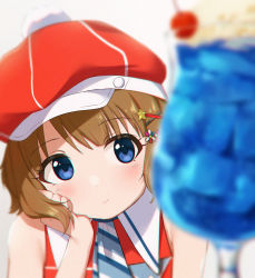Rule 34 | 1girl, blue eyes, blurry, blurry foreground, blush, brown hair, closed mouth, food, hair ornament, hairclip, hat, head rest, highres, ice cream, ice cream float, idolmaster, idolmaster million live!, idolmaster million live! theater days, jelly pop beans, red hat, short hair, simple background, sleeveless, solo, suou momoko, tsunenorip, upper body, white background