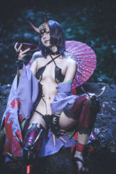 Rule 34 | 1girl, artist request, bare legs, blurry, blurry background, breasts, cosplay, fate/grand order, fate (series), feet, female focus, horns, looking at viewer, night, outdoors, photo (medium), purple eyes, purple hair, short hair, shuten douji (fate), shuten douji (fate) (cosplay), sitting, skin-covered horns, small breasts, solo, toes
