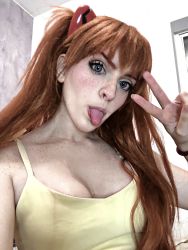 Rule 34 | 1girl, brazilian (nationality), breasts, brown hair, cleavage, cosplay, dress, freckles, highres, looking at viewer, memepantazis, neon genesis evangelion, photo (medium), real life, souryuu asuka langley, souryuu asuka langley (cosplay), sundress, tongue, tongue out, twintails, two side up, yellow dress