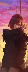 Rule 34 | 1girl, absurdres, against fence, black jacket, chain-link fence, cowboy shot, fence, highres, higuchi madoka, idolmaster, idolmaster shiny colors, jacket, long sleeves, looking at viewer, modare, mole, mole under eye, open clothes, open jacket, red eyes, red hair, solo, sunset, zipper