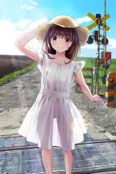 Rule 34 | 1girl, arm up, bad id, bad pixiv id, blush, brown eyes, brown hair, chikuwa (odennabe), closed mouth, day, dress, hand on headwear, hat, highres, lens flare, light rays, long hair, looking at viewer, original, outdoors, railroad crossing, see-through silhouette, short sleeves, smile, solo, standing, sun hat, sunbeam, sundress, sunlight, white dress