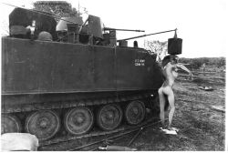 Rule 34 | 1girl, ass, bathing, breasts, combat helmet, dongsa wonhyong, from behind, greyscale, helmet, intrepid (kancolle), kantai collection, large breasts, long hair, military, military vehicle, monochrome, motor vehicle, nude, outdoors, photo background, ponytail, solo, standing, tank, vietnam war, washing