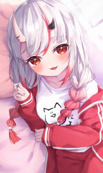 Rule 34 | 1girl, absurdres, bed sheet, blush, breasts, clothes writing, collarbone, commentary request, gradient hair, grey hair, hair between eyes, highres, hololive, horns, jacket, long hair, long sleeves, looking at viewer, low twintails, lying, masaki (msk064), multicolored hair, nakiri ayame, nakiri ayame (off-work), on side, oni, open mouth, pants, pillow, puffy long sleeves, puffy sleeves, red eyes, red hair, red jacket, red pants, shirt, sleeves past wrists, small breasts, smile, solo, track jacket, track pants, track suit, twintails, virtual youtuber, white shirt