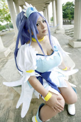 Rule 34 | 1girl, ankle boots, asian, blue eyes, blue hair, boots, bow, bracelet, breasts, choker, chouzuki maryou, cleavage, cosplay, cure diamond (cosplay), dokidoki! precure, dress, headpiece, highres, jewelry, large breasts, long hair, magical girl, matching hair/eyes, photo (medium), plump, ponytail, precure, puffy short sleeves, puffy sleeves, ribbon, short sleeves, sitting, solo, tiara