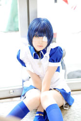 Rule 34 | 1girl, apron, arms between legs, asian, blue eyes, blue gloves, blue hair, blue socks, collar, color contacts, cosplay, cross, eyepatch, gloves, highres, ikkitousen, indoors, kneehighs, knees together feet apart, looking at viewer, maid, maid apron, namada, on floor, photo (medium), puffy short sleeves, puffy sleeves, ryomou shimei, ryomou shimei (cosplay), short sleeves, sitting, socks, solo