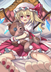 Rule 34 | 1girl, absurdres, back bow, barefoot, blonde hair, bow, button eyes, buttons, crystal, fang, flandre scarlet, hat, hat ribbon, highres, hugging doll, hugging object, long hair, looking at viewer, mob cap, multicolored wings, on bed, one side up, open mouth, puffy short sleeves, puffy sleeves, red eyes, red nails, red skirt, ribbon, short sleeves, side ponytail, sitting, skirt, smile, solo, stuffed animal, stuffed toy, stuffing, teddy bear, touhou, white bow, white hat, wings, wrist cuffs, yuuka (a0240765)