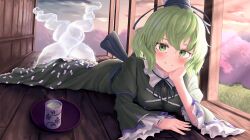 Rule 34 | 1girl, black hat, blush, closed mouth, commentary, cross-laced clothes, cup, dress, full body, ghost tail, green dress, green eyes, green hair, hand on own face, hat, highres, light rays, long sleeves, looking at viewer, lying, ofuda, ofuda on clothes, on stomach, pygrenix, short hair, smile, soga no tojiko, solo, tate eboshi, touhou, wide sleeves