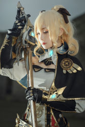 Rule 34 | 1girl, artist request, asian, badge, belt, black bow, black ribbon, blonde hair, blue eyes, bow, breasts, cosplay, detached sleeves, earrings, ears visible through hair, genshin impact, gloves, gold trim, hair between eyes, hair bow, half-closed eyes, high ponytail, highres, holding, holding sword, holding weapon, jean (genshin impact), jean (genshin impact) (cosplay), jewelry, long sleeves, neck ribbon, photo (medium), ponytail, ribbon, shirt, sidelocks, small breasts, solo, sword, upper body, weapon, white ribbon, white shirt