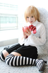 Rule 34 | 1girl, amane misa, amane misa (cosplay), apple, asian, blonde hair, breasts, cosplay, cross, cross necklace, death note, food, fruit, indoors, jewelry, kipi-san, looking at viewer, miniskirt, mole, nail polish, necklace, photo (medium), sitting, skirt, small breasts, solo, striped clothes, striped thighhighs, thighhighs, wariza